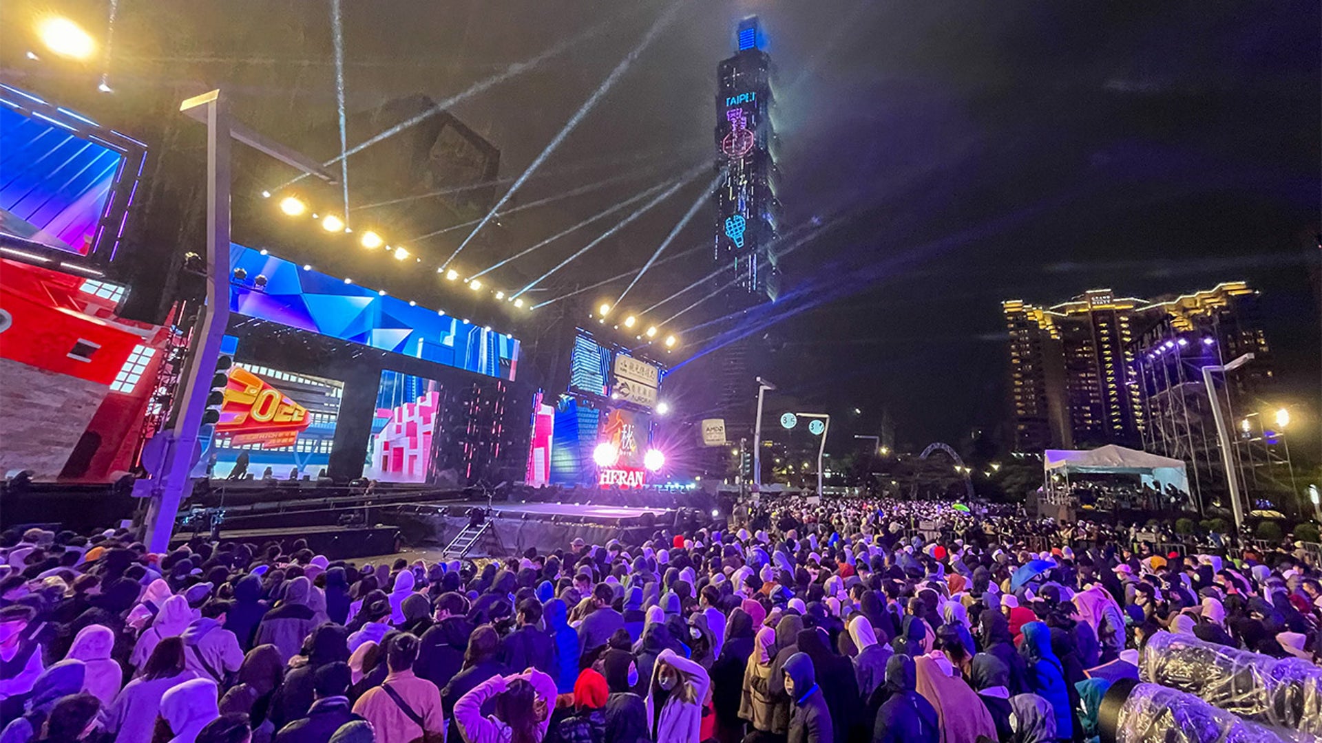 People gather for New Year celebration as they waiting for the 6 minutes fireworks show at Xinyi District, Taipei, Taiwan on December 31, 2021.