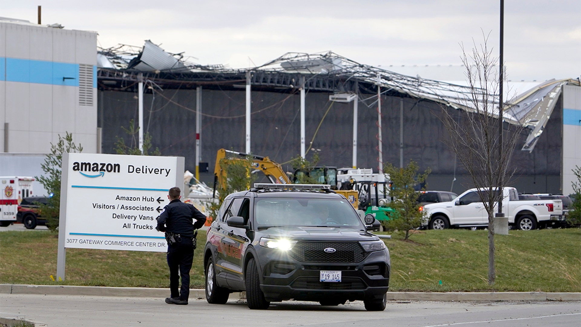 A heavily damaged Amazon fulfillment center is seen Saturday, Dec. 11, 2021, in Edwardsville, Ill. A large section of the roof of the building was ripped off and walls collapsed when a strong storms moved through area Friday night.