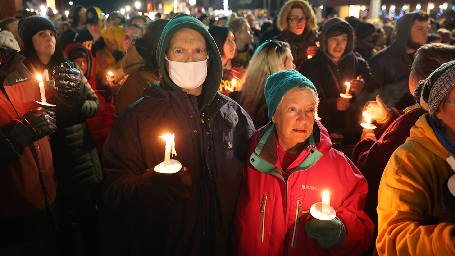 People attend a vigil downtown to honor those killed and wounded during the recent shooting at Oxford High School on December 03, 2021 in Oxford, Michigan. Four students were killed and seven others injured on November 30, when student Ethan Crumbley allegedly opened fire with a pistol at the school. Crumbley has been charged in the shooting. Today his parents were also charged.