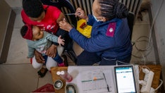 COVID vaccine manufacturers rush to update shot amid omicron