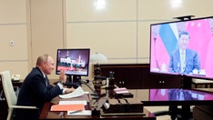 Russia, China champion strengthening ties during virtual summit