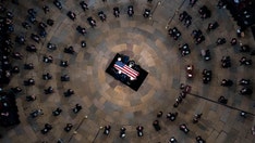 Bob Dole lies in state in Capitol Rotunda, where Biden, lawmakers pay tribute to 'giant of our history'