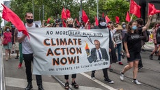 Camera crane swings into action, knocking climate protester to the ground during live Swedish dance show