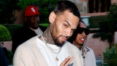 Chris Brown held in custody following arrest over alleged London nightclub attack
