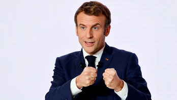 Macron defends his actions as he considers presidential race