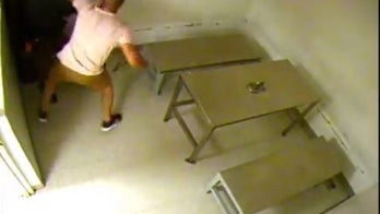 Miami-Dade police officer knocked unconscious by a suspect during booking at headquarters