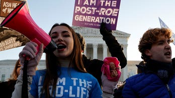 Where do Americans stand on abortion and on potentially overturning Roe v. Wade?