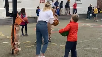 3rd grade teacher promises kids hot cocoa if she makes basketball shot