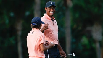 Woods returns with 3 shots that look like the Tiger of old