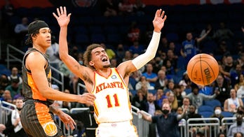 Young overcomes neck injury, Hawks beat Magic 111-99