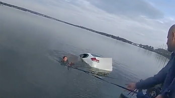 Maryland sheriff's deputies rescue woman from car submerged in frigid lake