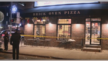 Philadelphia pizza worker's teen son shoots robbery suspect in the face