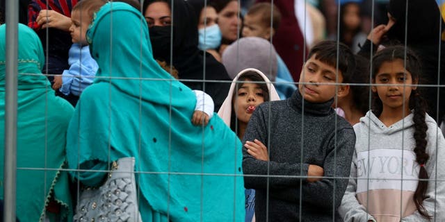 Evacuees from Afghanistan are seen at their temporary shelter inside the U.S. Army Rhine Ordonanz Barracks in Kaiserslautern, Germany, August 30, 2021.