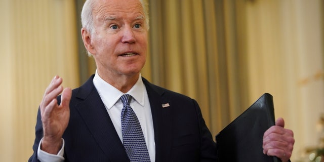U.S. President Joe Biden speaks with reporters after delivering remarks on the November jobs report at the White House in Washington, U.S., December 3, 2021. REUTERS/Kevin Lamarque