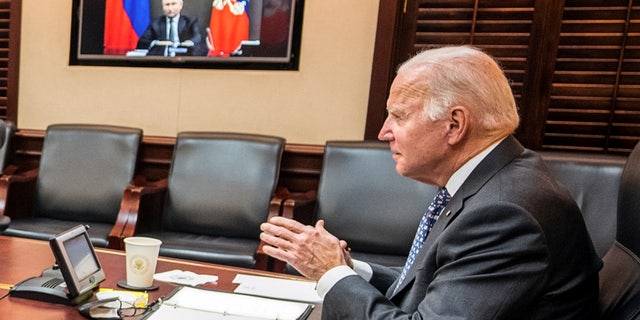 U.S. President Joe Biden holds virtual talks with Russia's President Vladimir Putin amid Western fears that Moscow plans to attack Ukraine, during a secure video call from the Situation Room at the White House in Washington, U.S., December 7, 2021. The White House/Handout via REUTERS.