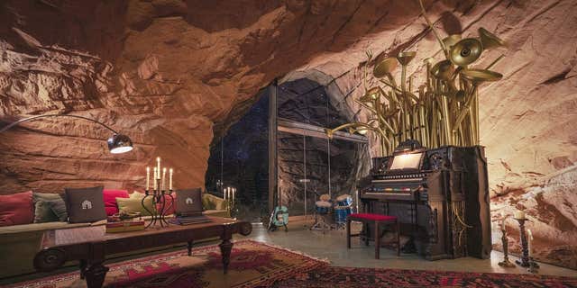 The residence is a 5,700-square-foot "lair" that sits inside a hand-carved cave.