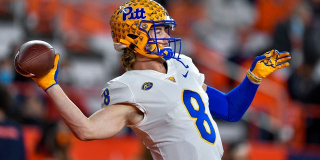 Pittsburgh quarterback Kenny Pickett warms up before an NCAA college football game against Syracuse in Syracuse, N.Y., Saturday, Nov. 27, 2021.