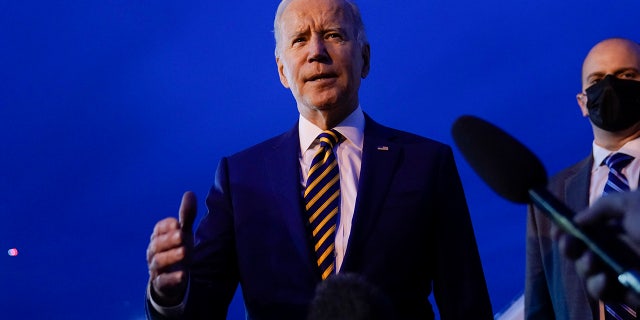 President Joe Biden speaks to members of the media before boarding Air Force One at Minneapolis-Saint Paul International Airport in Minneapolis, Tuesday, Nov. 30, 2021. (AP Photo/Carolyn Kaster)