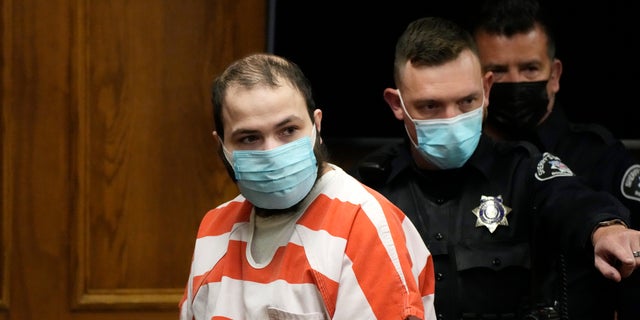 Ahmad Al Aliwi Alissa, accused of killing 10 people at a Colorado supermarket in March, is led into a courtroom for a hearing Tuesday, Sept. 7, 2021, in Boulder, Colo. Experts have found Alissa is mentally incompetent to proceed in the case. (AP Photo/David Zalubowski/Pool, File)