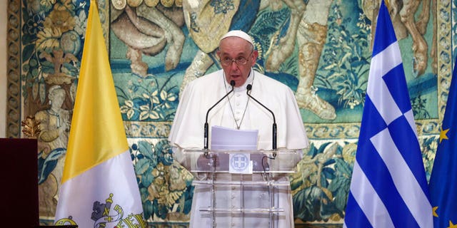 Pope Francis delivers his speech during a meeting with authorities, at the Presidential Palace, in Athens, Saturday, Dec. 4, 2021. Pope Francis arrived to Greece Saturday for the second leg of his trip to the region with meetings in Athens aimed at bolstering recently-mended ties between the Vatican and Orthodox churches. (AP Photo/Yorgos Karahalis, Pool)