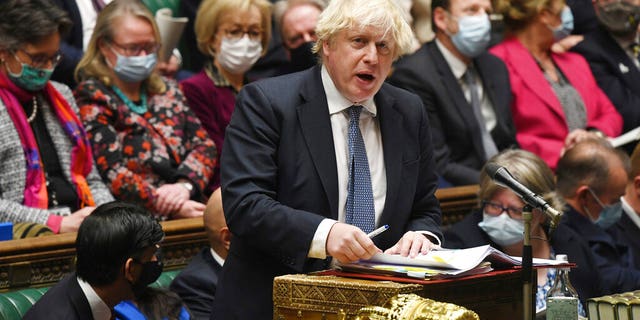 In this photo posted by the UK Parliament, British Prime Minister Boris Johnson speaks during the Prime Minister's questions in the House of Commons, London, Wednesday, December 8, 2021. (Jessica Taylor / UK Parliament via AP)