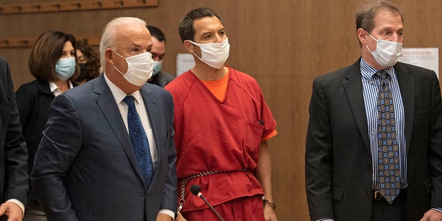 Scott Peterson listens to Stanislaus County Deputy District Attorney Dave Harris speak during a hearing at the San Mateo County Superior Court in Redwood City, Calif., Dec. 8, 2021. Nearly 17 years after being sentenced to die, Peterson was resentenced to life without parole during an emotional hearing in which family members of his slain pregnant wife, Laci, called him out for the killing in 2002 and his apparent lack of remorse.