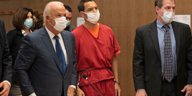 Scott Peterson listens to Stanislaus County Deputy District Attorney Dave Harris speak during a hearing at the San Mateo County Superior Court in Redwood City, Calif., Dec. 8, 2021. Nearly 17 years after being sentenced to die, Peterson was resentenced to life without parole during an emotional hearing in which family members of his slain pregnant wife, Laci, called him out for the killing in 2002 and his apparent lack of remorse.