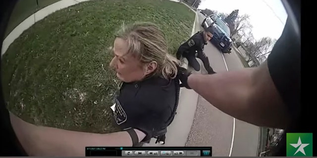 In this screen grab, police body cam video is shown in court on Friday, Dec. 10, 2021 at Hennepin County Courthouse in Minneapolis, Minnesota, of former Brooklyn Center Police Officer Kim Potter reacting after a traffic stop in which Daunte Wright was shot on April 11, 2021. (Court TV, via AP, Pool)