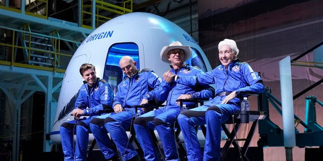 FILE - Oliver Daemen, from left, Mark Bezos, Jeff Bezos, founder of Amazon and space tourism company Blue Origin, and Wally Funk, right, participates in a post launch briefing where they discussed their flight experience aboard the Blue Origin New Shepard rocket at its spaceport near Van Horn, Texas, on July 20, 2021. The Federal Aviation Administration said Friday, Dec. 10, 2021, they are no longer present commercial astronaut wings starting next year, too many people are launching into space. All 15 people who rocketed into space this year on private flights from the U.S. will still receive their wings from the FAA. 