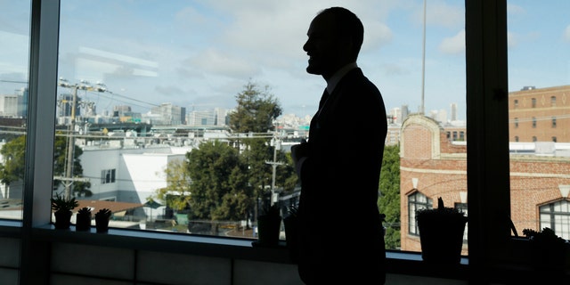 FILE - San Francisco District Attorney Chesa Boudin looms as he gazes at the skyline from his office in San Francisco on January 30, 2020 (AP Photo / Eric Risberg, File)