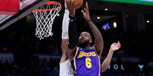 Los Angeles Lakers forward LeBron James goes to the basket during the first half against the Oklahoma City Thunder on Dec. 10, 2021, in Oklahoma City, Oklahoma.