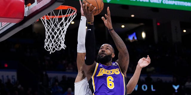 Los Angeles Lakers forward LeBron James goes to the basket during the first half against the Oklahoma City Thunder on Dec. 10, 2021, in Oklahoma City, Oklahoma.