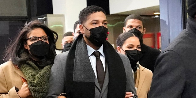 Actor Jussie Smollett, center, leaves the Leighton Criminal Courthouse with unidentified siblings, Thursday, Dec. 9, 2021, in Chicago, following a verdict in his trial. Smollett was convicted Thursday on five of six charges he staged an anti-gay, racist attack on himself nearly three years ago and then lied to Chicago police about it. 