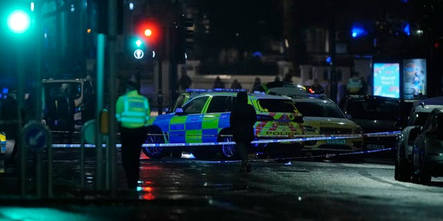 British police say a man has been shot dead during a confrontation with firearms officers near the Kensington Palace royal residence. (Aaron Chown/PA via AP)