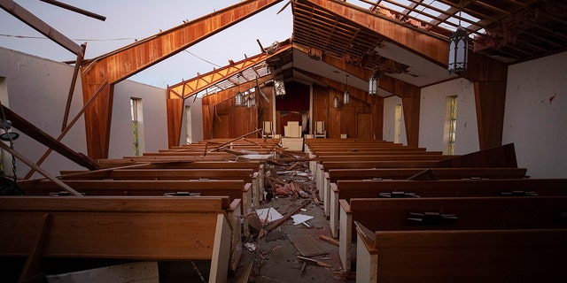 The remains of Dawson Springs Primitive Baptist Church after a tornado in Dawson Springs, Ky., Sunday, Dec. 12, 2021.  (AP Photo/Michael Clubb)