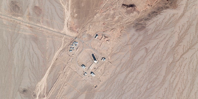 In this satellite photo by Planet Labs Inc., activity is seen at the Imam Khomeini Spaceport in Semnan province, Iran, Saturday, Dec. 11, 2021.  (Planet Labs Inc. via AP)