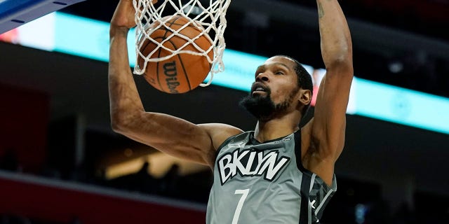 Brooklyn Nets forward Kevin Durant dunks during the second half of a game against the Detroit Pistons Dec. 12, 2021, in Detroit.
