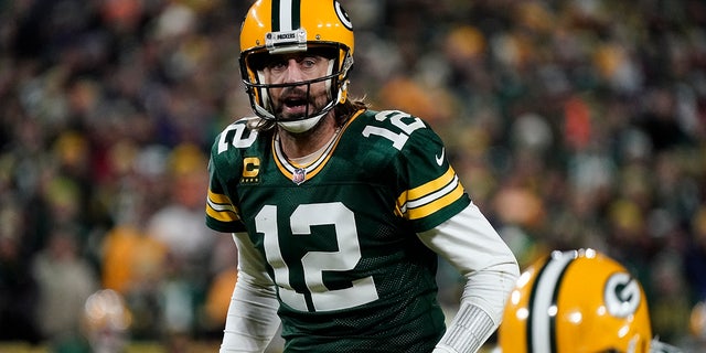 Green Bay Packers' Aaron Rodgers takes a snap during the second half of an NFL football game against the Chicago Bears Sunday, Dec. 12, 2021, in Green Bay, Wis. (AP Photo/Morry Gash)