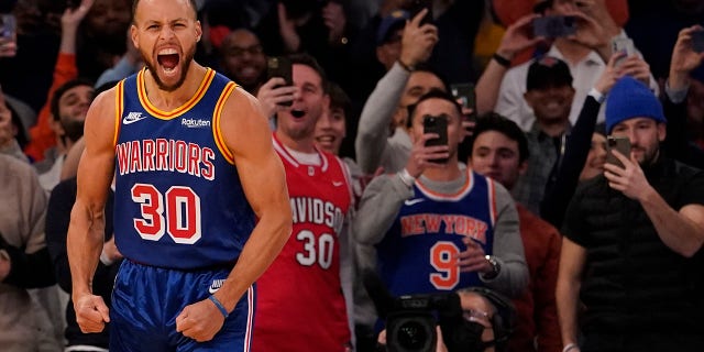 Golden State Warriors guard Stephen Curry reacts after scoring a 3-point basket during the first half of an NBA basketball game against the New York Knicks, Tuesday, Dec. 14, 2021, at Madison Square Garden in New York. Curry hit his 2,974th 3-pointer Tuesday night in the first quarter, breaking the record set by Ray Allen.