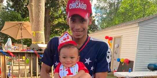 FILE - This photo provided by Ben Crump Law, PLLC. shows Daunte Wright and his son, Daunte Jr., at his first birthday party.