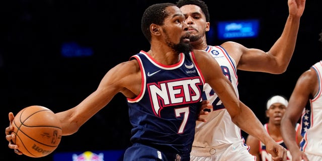 Brooklyn Nets forward Kevin Durant drives against Philadelphia 76ers forward Tobias Harris on Dec. 16, 2021, in New York.