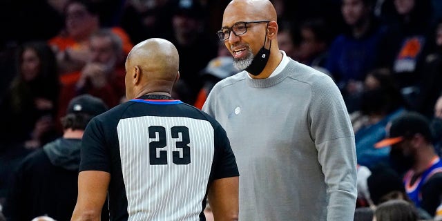Phoenix Suns head coach Monty Williams, right, claims a foul called against the Suns with referee Tre Maddox (23) during the second half of an NBA basketball game on Thursday, Dec. 16, 2021, in Phoenix. The Suns won 118-98.