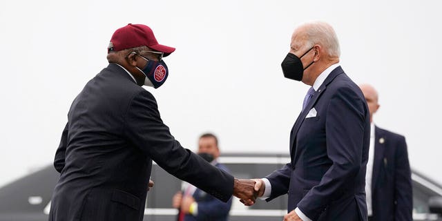 President Joe Biden is greeted by Rep. James Clyburn as he arrives at Columbia Metropolitan Airport on Air Force One in West Columbia, South Carolina, on Dec. 17, 2021.