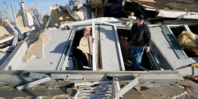 Kentucky's Missing Tornado Victims Have Been Accounted For, Governor Says 4 Kenny Sanford exits his mother-in-law's apartment through a collapsed wall Saturday, Dec. 11, 2021, in Mayfield, Kentucky.