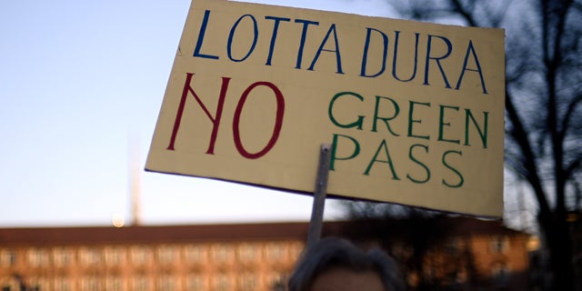 People gather to protest against Italy's covid Green Pass in Turin, Italy, Saturday Dec. 18, 2021. (Fabio Ferrari/LaPresse via AP)