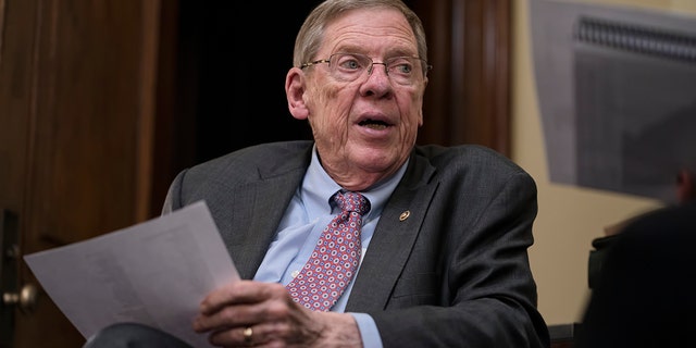 FILE - Sen. Johnny Isakson, R-Ga., meets with his staff in his office on Capitol Hill in Washington, Dec. 2, 2019. Isakson, an affable Georgia Republican politician who rose from the ranks of the state Legislature to become a U.S. senator, has died. He was 76. Georgia Gov. Brian Kemp’s office confirmed the death in a news release Sunday, Dec. 19, 2021. (AP Photo/J. Scott Applewhite, file)