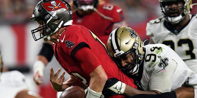 Saints frustrate Brady as soon as more, beat SB champ Buccaneers 9-0 2 Tampa Bay Buccaneers quarterback Tom Brady (12) fumbles the football after getting hit by New Orleans Saints defensive end Cameron Jordan (94) during the second half of an NFL football game Sunday, Dec. 19, 2021, in Tampa, Fla. (AP Photo/Jason Behnken)