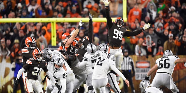 Las Vegas Raiders kicker Daniel Carlson (2) boots a winning 48-yard field goal during the second half of an NFL football game against the Cleveland Browns, Monday, Dec. 20, 2021, in Cleveland.