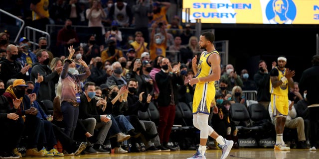 Golden State Warriors guard Stephen Curry is acknowledged by the crowd during the first half of an NBA basketball game against the Sacramento Kings in San Francisco, Monday, Dec. 20, 2021.