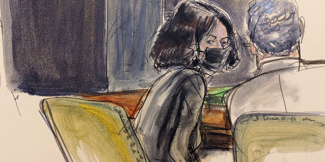 Ghislaine Maxwell, left, speaks to her defense attorney Jeffrey Pagliuca after the reading of the jury's second note during Maxwell's sex trafficking trial, Tuesday, Dec. 21, 2021, in New York. (Elizabeth Williams via AP)
